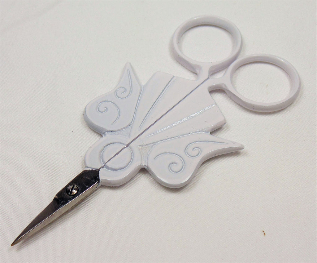 Angel embroidery scissors shown with protective leather case
